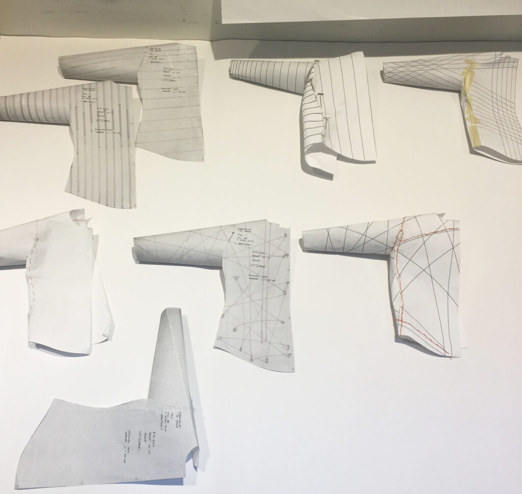 Print exploration on folded paper shirt mock-ups